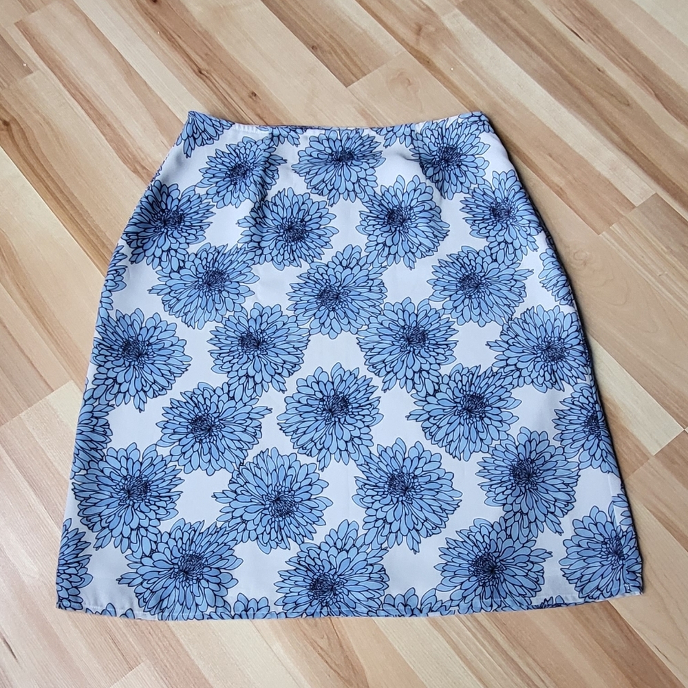 Apostrophe, blue flower skirt